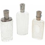 (3) piece lot of perfume bottles silver.