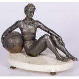A bronze statuette of a seated turning lady with large ball, France, mid. 20th century.