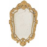 A carved gold painted wooden mirror frame, Italy, 1st half of the 20th century.
