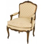 A nutwood Louis XV-style bergère/ armchair, ca. 1900.