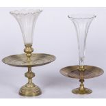 Two cast brass pièces de millieu with arabesks and pressed glass beaker.