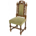 A high back chair with carvings, Dutch, ca. 1900.