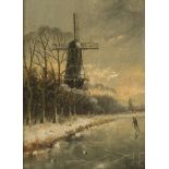 Adrianus Kuijpers (Gorkum 1862 - 1945 Amsterdam), A figure on the ice, a windmill on the banks.