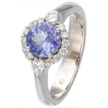18K. White gold rosette ring set with approx. 0.32 ct. diamond and approx. 0.96 ct. tanzanite.