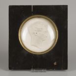 A 19th C. plaster relief plaquette (tondo) portrait of a man behind concave glass.