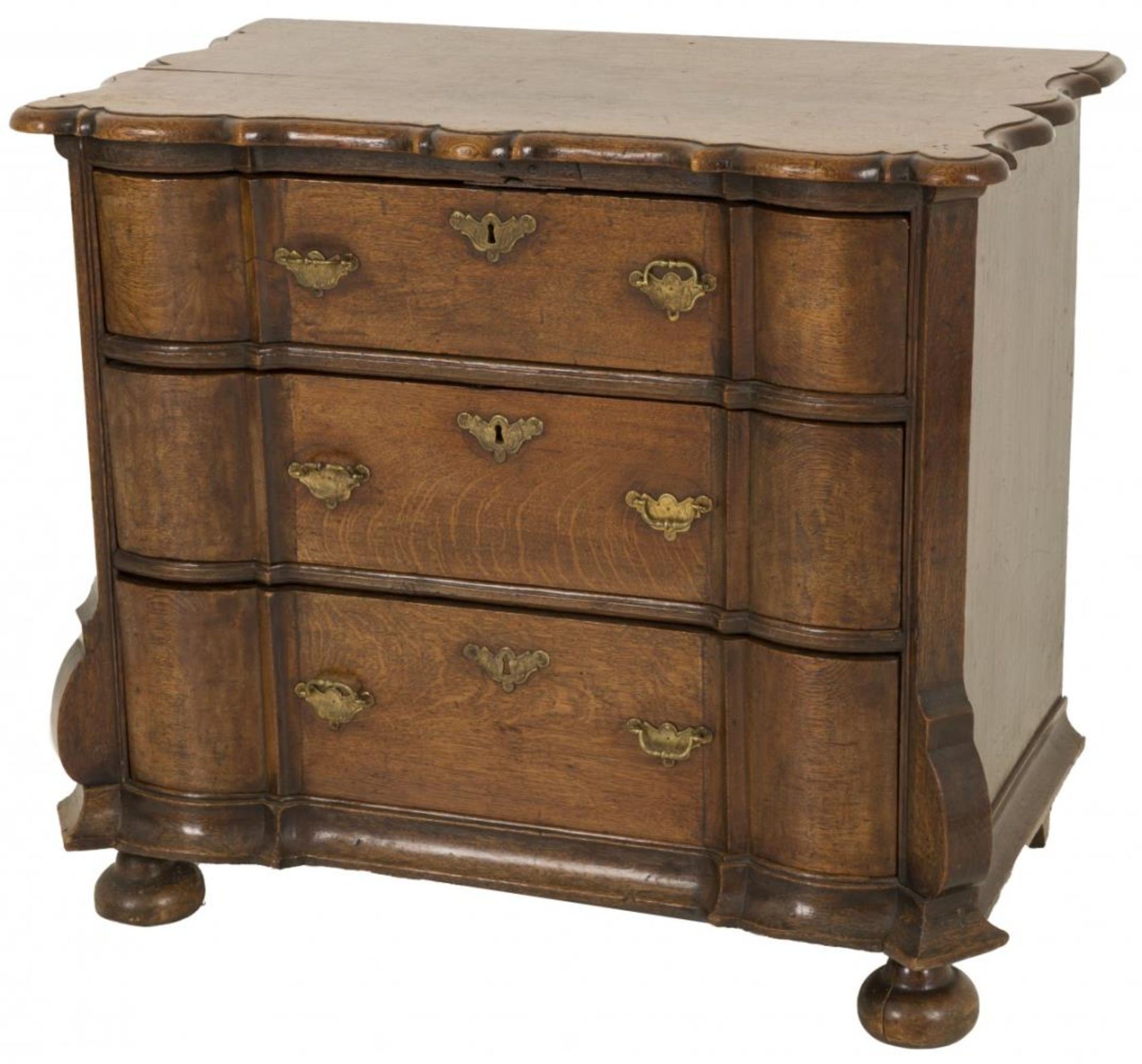 An oakwood three-drawer commode, Dutch, 2nd half 18th century.