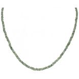 Single strand necklace with natural green sapphire and a 14K. yellow gold closure.