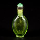 A green glass snuff bottle, marked Qianlong, China, 18th/19th century.