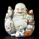 A porcelain Buddha with children, China, 1st half 20th century.