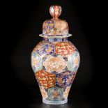 A porcelain Arita lidded vase with floral decoration in compartments, Japan, 19th century.