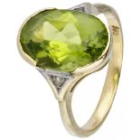 14K. Yellow gold oval ring set with approx. 0.02 ct. diamond and approx. 3.53 ct. peridot.