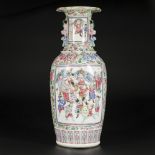 A porcelain baluster vase with floral decorations and in the centre a scene with several warriors, C