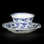 A porcelain cup and saucer, angled model with floral decorations, China, Kangxi.