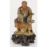 A soapstone sculpture of a scholar, China, 1st half 20th century.