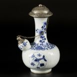 A porcelain kendi with white metal spout and lid, China, 18th century.