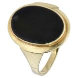 14K. Yellow gold oval signet ring set with onyx.