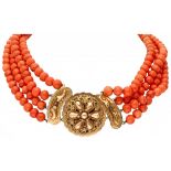 Antique four-row red coral necklace with a richly decorated 14K. yellow gold filigree closure.