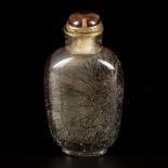 A snuff bottle, rutile quartz with hair, China, 19th century.