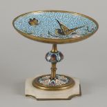 A cloisonné tazza depicting a bird and butterfly on an appleblossom, France ca. 1900.