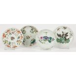 A lot comprising (4) porcelain plates with floral decor.