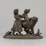 A bronze group of children playing with a dog, cast ca. 1900.