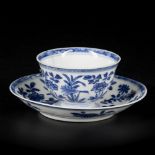 A porcelain cup and saucer with floral decorations and 6-character mark, China, Kangxi.