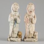 A pair of identical "foulk art" casts with remnants of polychrome.
