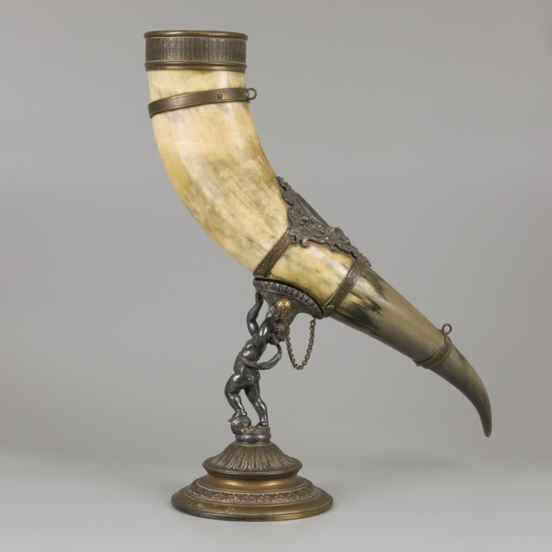 A drinking horn made of an ox horn, carried by a putto, ca. 1920. - Image 2 of 4