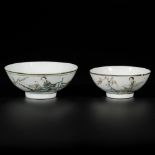 A lot of (2) porcelain Qiangjiang Cai bowls with figures in a garden, China, 19th/20th century.