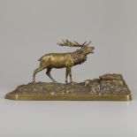 A bronze inkwell in the shape of a stag in a rocky landscape, ca. 1900.