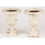 A set of (2) small cast iron garden vases, 20th century.