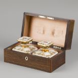A fruitwood veneered tea caddy, the interior with porcelain flasks, France, 19th century.