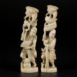 A set of (2) ivory okimonos in the shape of Japanese gentleman with animals, Japan, late Meiji perio