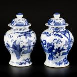 A set of (2) porcelain lidded vases with figurative decoration, China, 19th century.