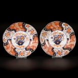 A lot comprising (2) porcelain lobed Imari plates with floral decoration, Japan, 19th century.