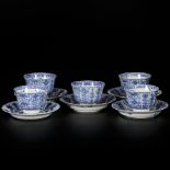 A set of (5) porcelain cups and saucers with floral decor, marked Kangxi. China, 19th century.