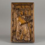 An carved oak bas-relief depicting St. john the Baptist with arma sacra, ca. 1900.