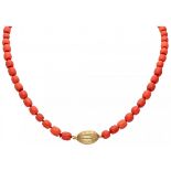Single strand red coral necklace with a 14K. yellow gold closure.
