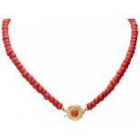 Antique single strand red coral necklace with a flower-shaped 14K. yellow gold closure.