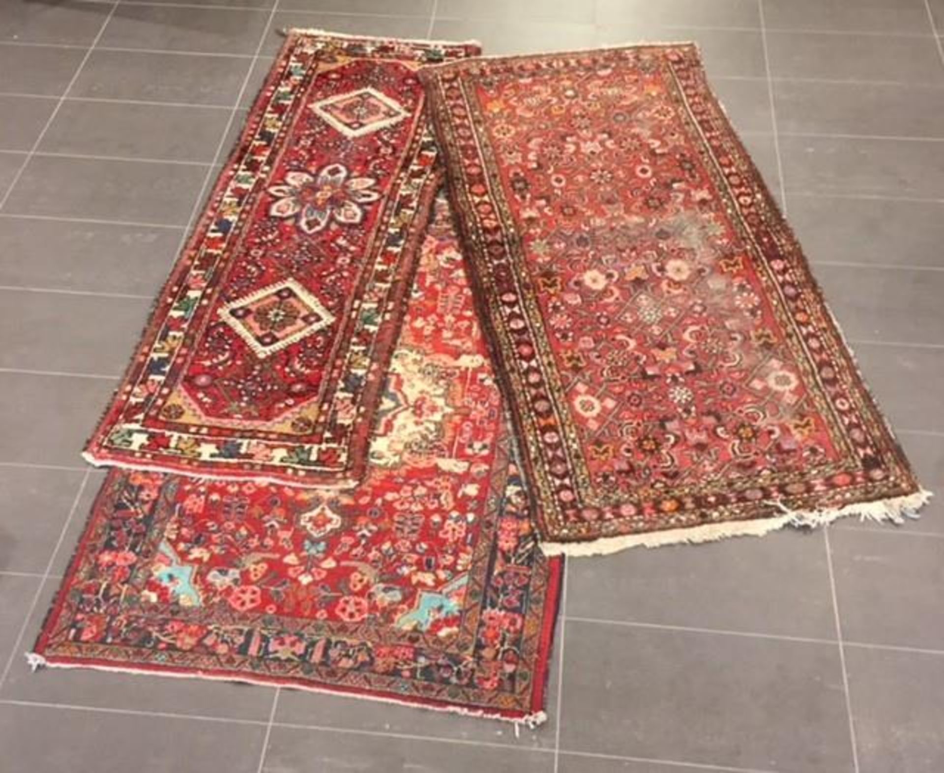 A lot comprised of (3) carpets, Iran, 2nd half 20th century.