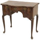 A mahogany veneered 'kneehole' desk, England, 18th century.