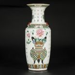 A porcelain Qiangjiang Cai vase with decoration of flowers in a vase, China, late 19th century.