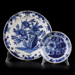 A lot comprising (2) earthenware chargers with floral decorations, Delft, 18th century.