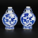 A set of (2) porcelain moonbottles decorated with playing "zotjes", marked Kangxi, China, 19th centu