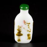 A glass snuff bottle decorated with antiques and cranes, China, 19th century.