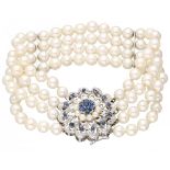 Four-row cultivated pearl bracelet with a 18K. white gold closure set with natural sapphire.