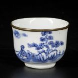 A porcelain cup with landscape decoration and metal rim lip, Vietnam, 19th century.