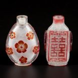 A lot comprising (2) glass snuff bottles with red double happiness character and floral decor, China