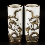 A set of (2) cylinder vases in Nanking earthenware, decorated with dragons, China, 19th century.