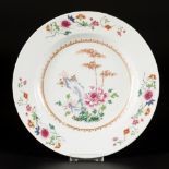A porcelain plate with floral landscape decor, China, 18th century.